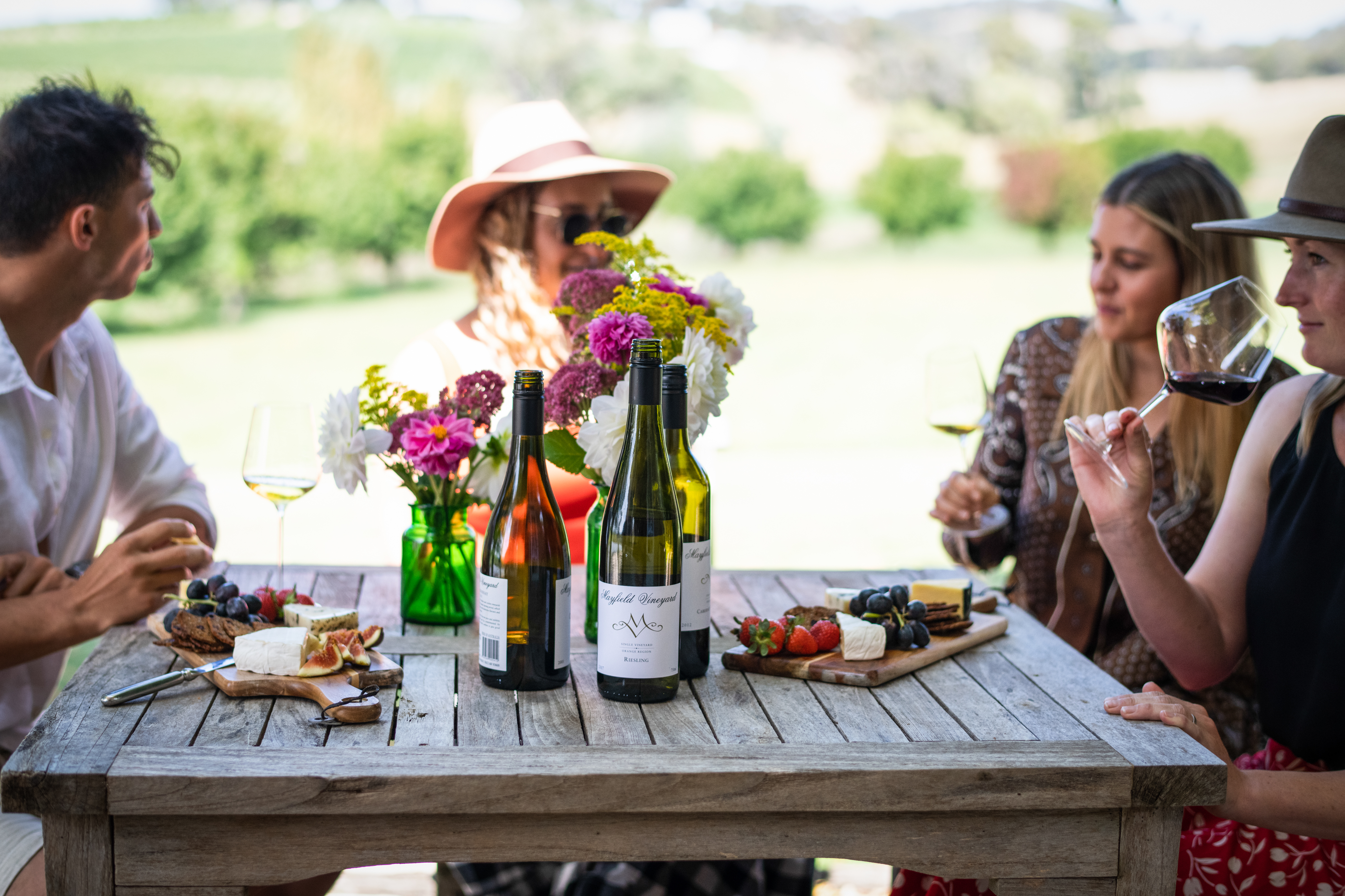 People drinking wine at Mayfield cellar door